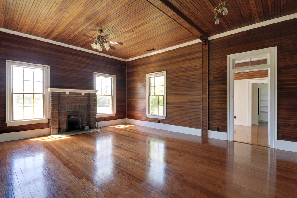 Unfurnished living room with wood paneling