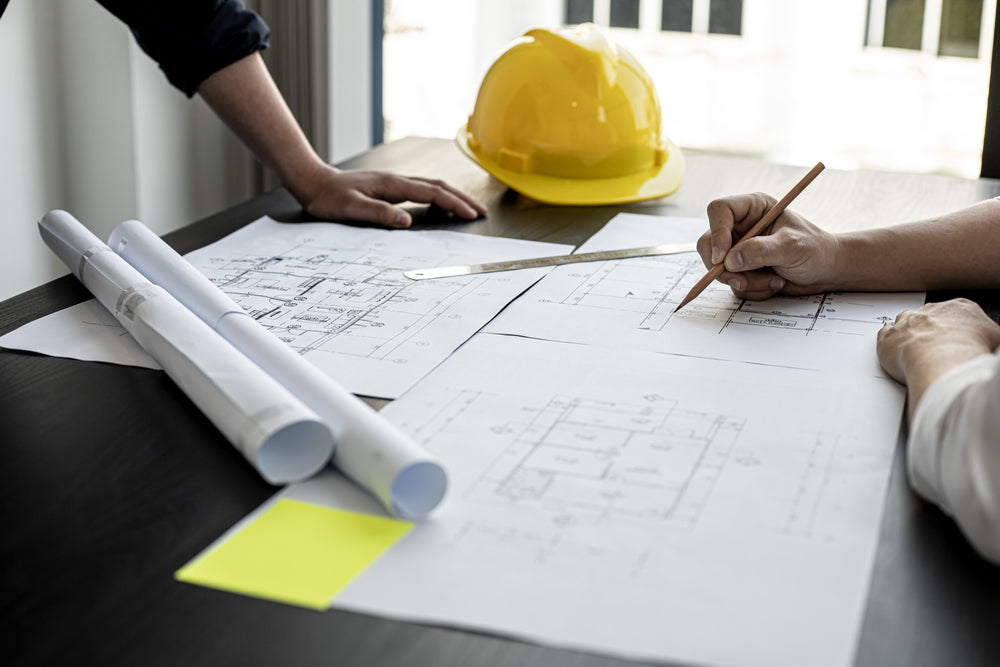 The architects and engineers were in a meeting to discuss the draft house plan